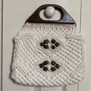 Macramé purse with wooden handles and beads. 10 1/2” x 12”H